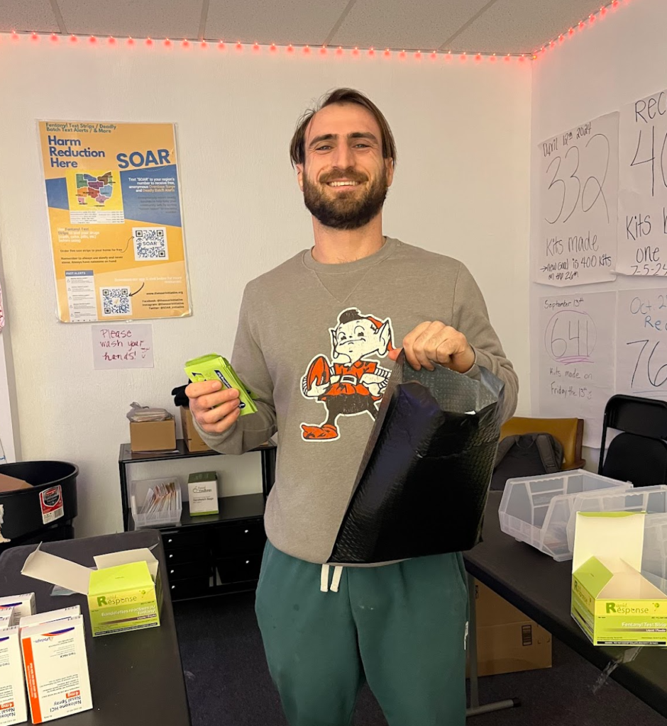 patrick holds mail order package